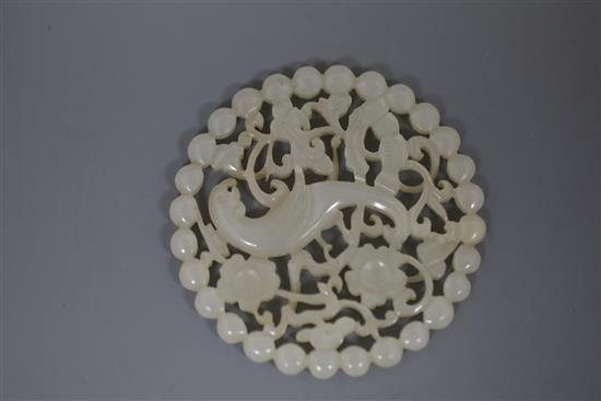 A fine Chinese white jade disc, 18th/19th century, D. 5.7cm